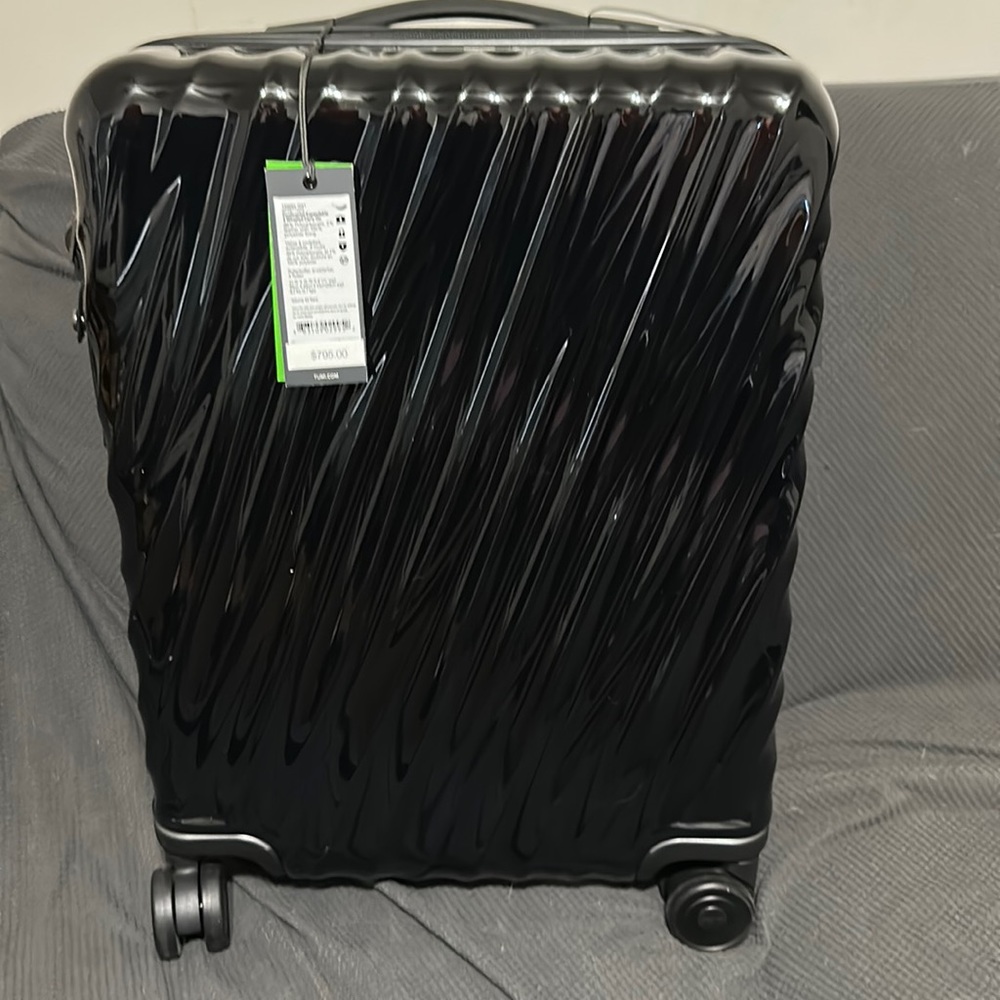 TUMI continental expandable 4 wheeled carry on - black - new with tags